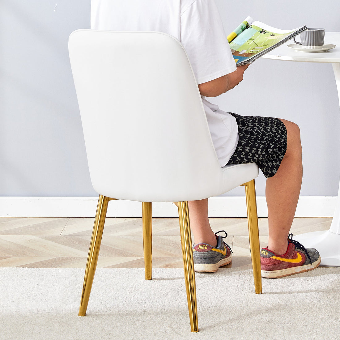 4 modern dining chairs, sleek PU leather backrest, and gold metal legs
