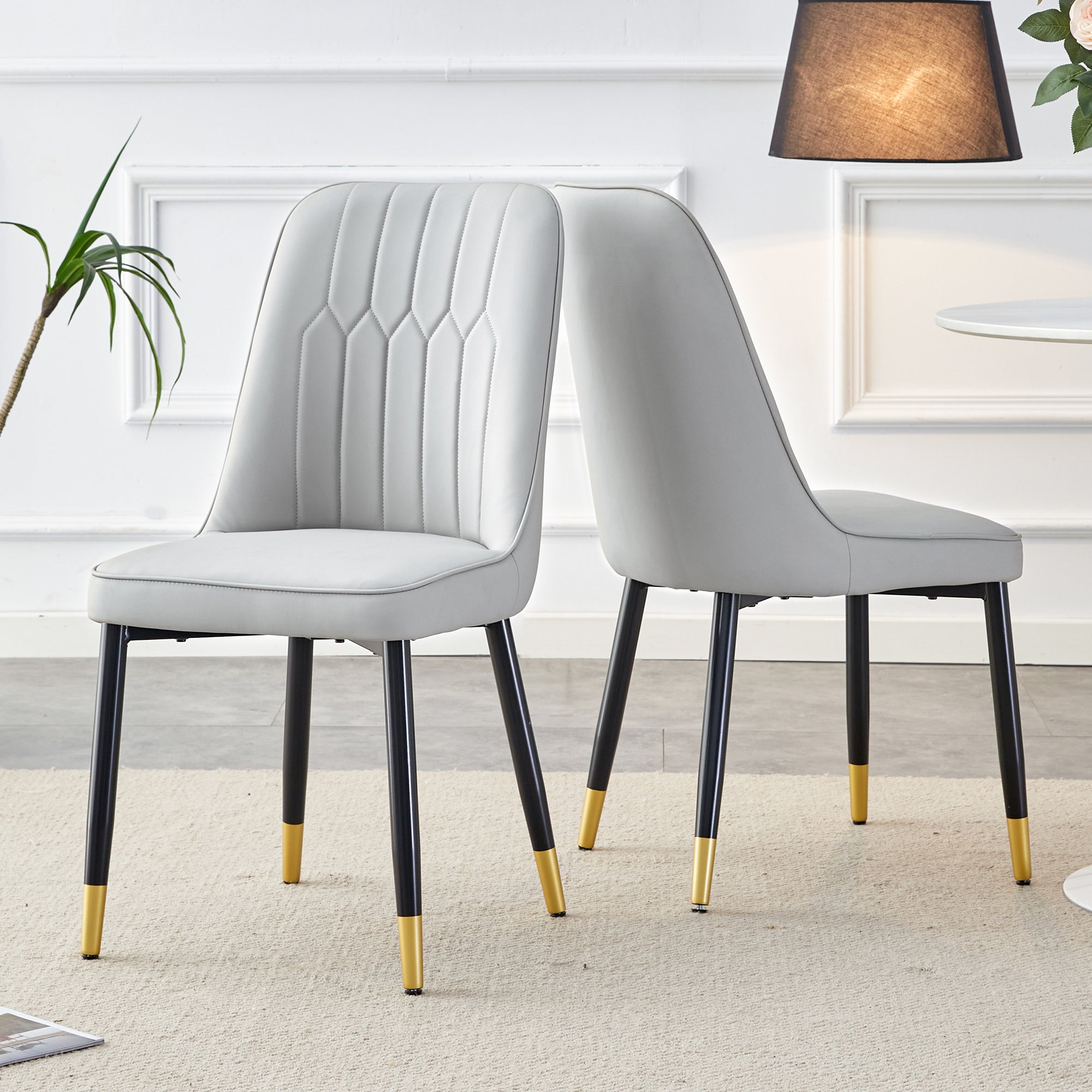 Light gray dining chairs and living room chairs. PU material and metal