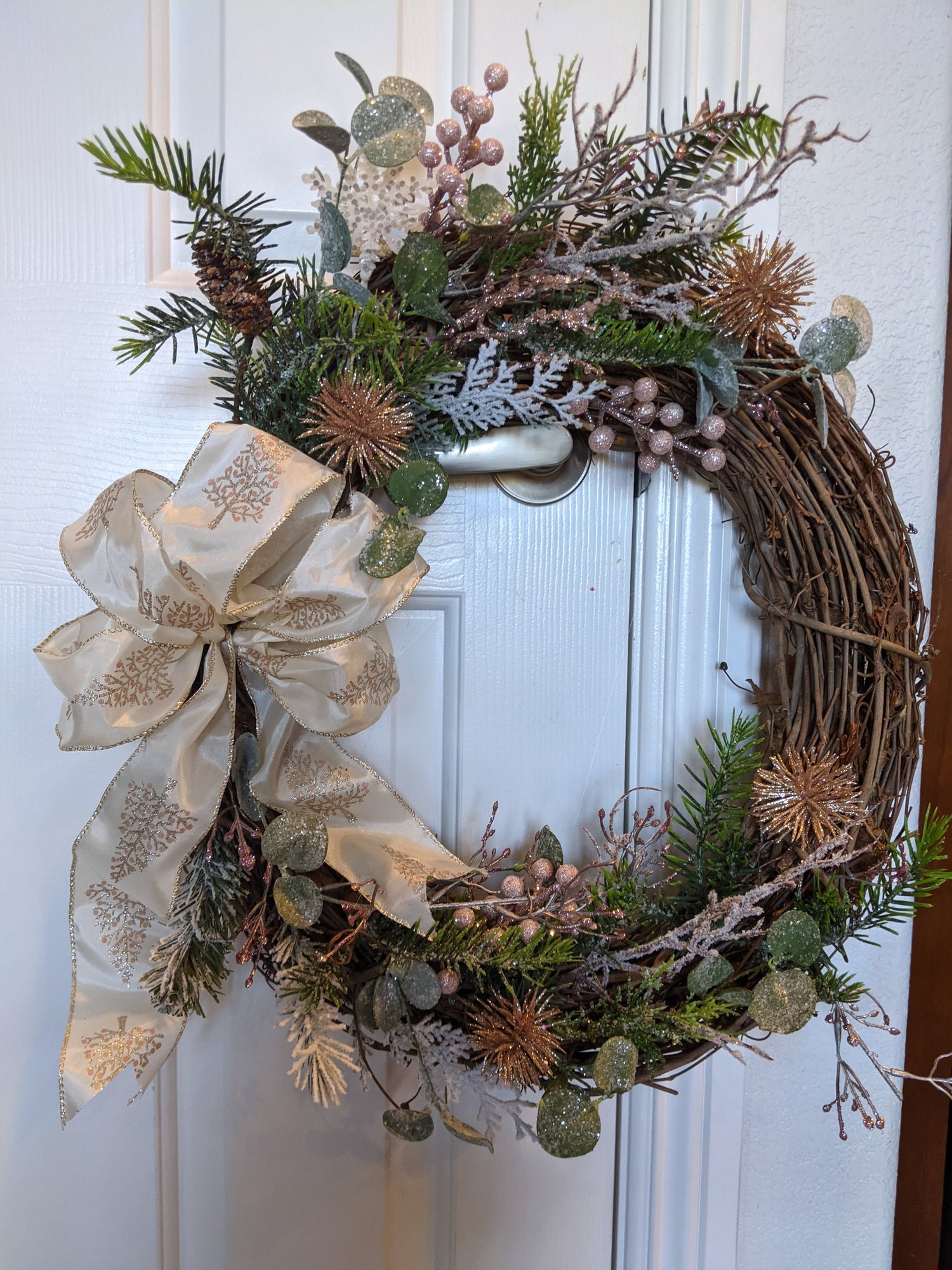 handmade 18 inch grapevine wreath with oretty shades of pink and
