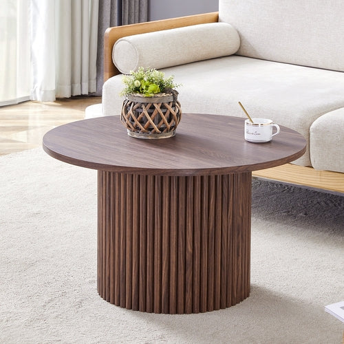 A modern circular coffee table with a diameter of 27.5 inches. MDF