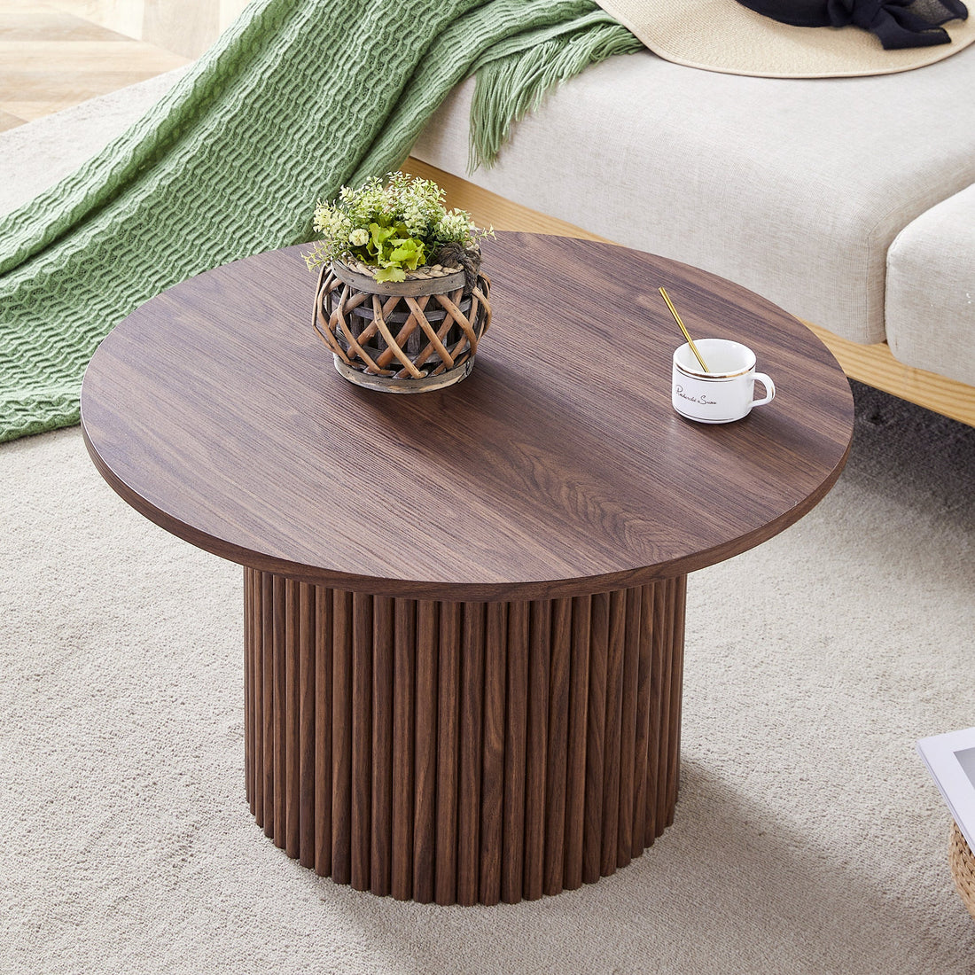 A modern circular coffee table with a diameter of 27.5 inches. MDF